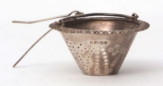 George IV tea strainer of tapering cylindrical basket form with applied rim and wirework handle with