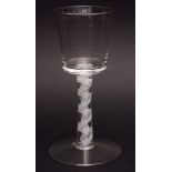 Plain bucket bowl wine glass with latticinio opaque twist stem and spreading circular foot, circa