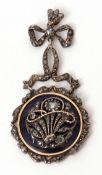 Antique blue enamel and diamond pendant, the circular plaque enamelled in royal blue overlaid with a