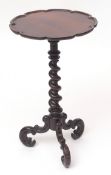19th century rosewood pedestal table, circular top with moulded edge, raised on a twisted support