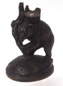 Black Forest carved model of a bear clutching a tree stump, circa early 20th century, 23cms high