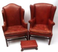 Georgian style red leather upholstered wing armchair and similarly upholstered porter's chair,