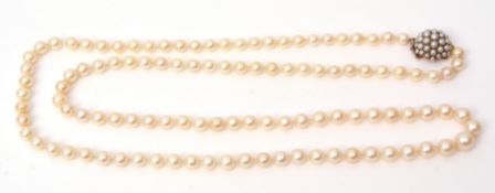 Long opera length cultured pearl necklace, a single row of uniform beads, 6mm approx, to a yellow