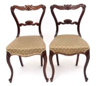 Set of six early 19th century mahogany dining chairs with scroll carved backs and centre rails,