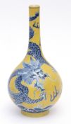 Chinese porcelain bottle vase decorated in underglaze blue and overglaze yellow with a writhing