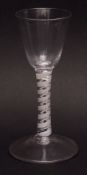 18th century round funnel double opaque cotton twist stemmed wine glass on a spreading circular