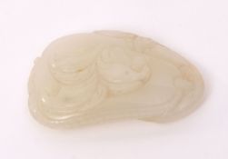 Chinese jade pendant in very pale celadon, carved as a stylised phoenix on a leafy gourd, 4.8cms