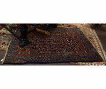 Caucasian rug, triple gulled border, central panel of geometric foliage, mainly red and blue