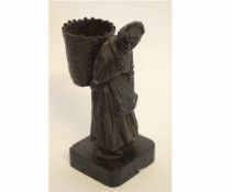 Bronze of an old lady carrying a wickerwork basket on her back on square base, 18cms high