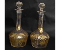 Pair of Georgian faceted and gilded sherry decanters with fluted stoppers, 17cms tall (2)