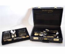 Leather cased Solingen stainless steel and gold plated cutlery set, each stamped "Edelstahl Rostfrei