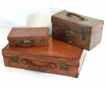 Vintage tan leather suitcase with brass latches, together with a further small leather case with