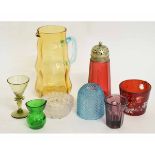 Group of Victorian and later coloured glass wares including cranberry sugar shaker, amber glass