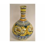 Late 19th/early 20th century faience baluster vase with knopped bottle formed neck, decorated with