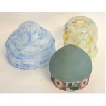 Collection of three glass lampshades, one of a mottled ground, one blue ground and a green ground