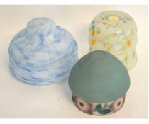 Collection of three glass lampshades, one of a mottled ground, one blue ground and a green ground
