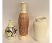 Collection of Poole ware vases, including one with floral sprays, another free-form vase with a