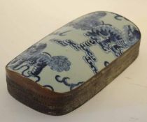 Unusual Oriental silvered metal and ceramic lidded rectangular box, the domed ceramic lid