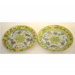 Pair of Chinese porcelain plates decorated in famille rose enamels, with courtiers, dogs and