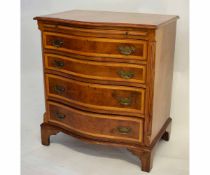 Reproduction serpentine fronted chest with brushing slide over four graduated drawers on bracket