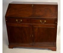 Georgian mahogany drop fronted bureau with pigeonholed interior with two drawers over two panelled