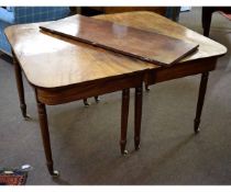 19th century mahogany D-end dining table, each end supported by four turned legs raised on porcelain