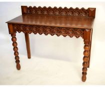 19th century oak hall table with carved floral front with repeating decoration and bobbin turned