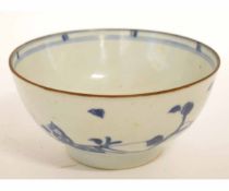 Nanking cargo blue and white circular bowl, sparsely decorated with blue floral sprigs, 14 1/2cms