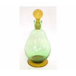 Art Deco period blown green glass decanter with amber glass foot and stopper, 24cms tall