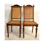 Pair of 19th century European dining chairs with cane backs and seats (one with missing finials)
