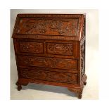 Mid-20th century Oriental hardwood bureau with drop front fitted with two over two full width