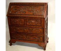 Mid-20th century Oriental hardwood bureau with drop front fitted with two over two full width