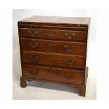 18th century oak lined bachelor's chest with brushing slide over four graduated drawers on bracket