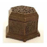 Oriental bronzed metal incense burner of octagonal form with prunus blossom pierced lid, 11cms diam