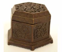 Oriental bronzed metal incense burner of octagonal form with prunus blossom pierced lid, 11cms diam