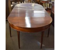 Georgian mahogany D-end dining table with central section with two drop leaves raised on tapering