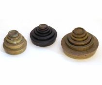 Two pairs of graduated circular brass weights together with a further cast set of brass weights (3)