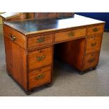 19th century twin pedestal campaign desk fitted all round with recessed military style handles, on