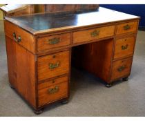 19th century twin pedestal campaign desk fitted all round with recessed military style handles, on