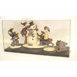 Unusual modern Yule tide set comprising snowman, children etc in a Perspex display case, 61,6cms