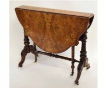 Victorian walnut Sutherland table with a shaped circular top and satinwood inlay supported by two