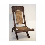 Hardwood Chieftain's chair of X-frame folding form with cane back and seat