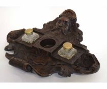 Carved treen ink stand decorated with masks and neo-classical designs etc and fitted with two