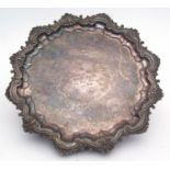Silver on copper salver, of shaped circular form with C-scroll and foliate applied rim, engraved