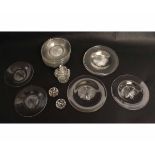 Group comprising thirteen glass ice plates with star cut centres, 13cms diam, seven further