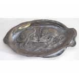 WMF shaped pewter dish depicting two figures to centre in a stylised design with raised mark of