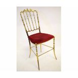 Good quality brass formed bedroom chair with spindle back and red Dralon upholstered seat on splayed