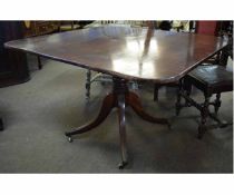 Georgian mahogany square topped pedestal table with turned column on a shaped quatrefoil base with