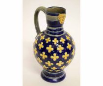 19th century Minton Majolica mask jug with yellow florets on a blue ground