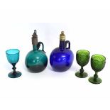 Group comprising two Victorian moulded green glass wines, and a clear green glass example plus a